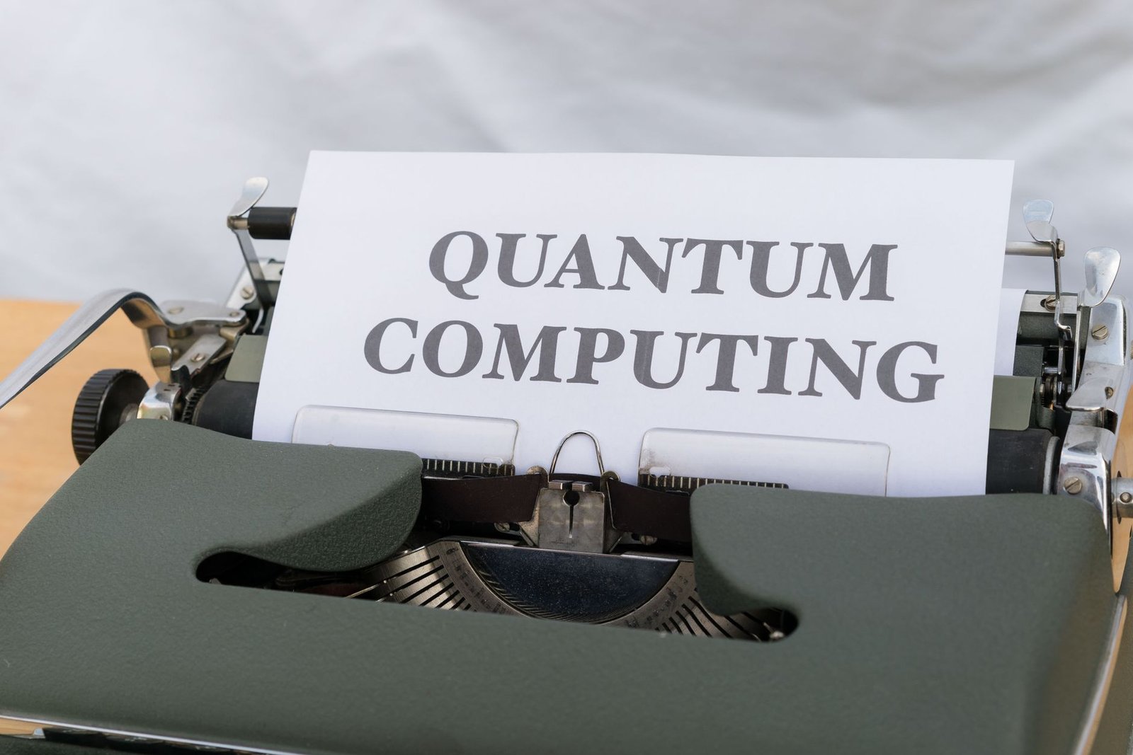 A close-up of a quantum computing chip with laser alignment optics on an optical table