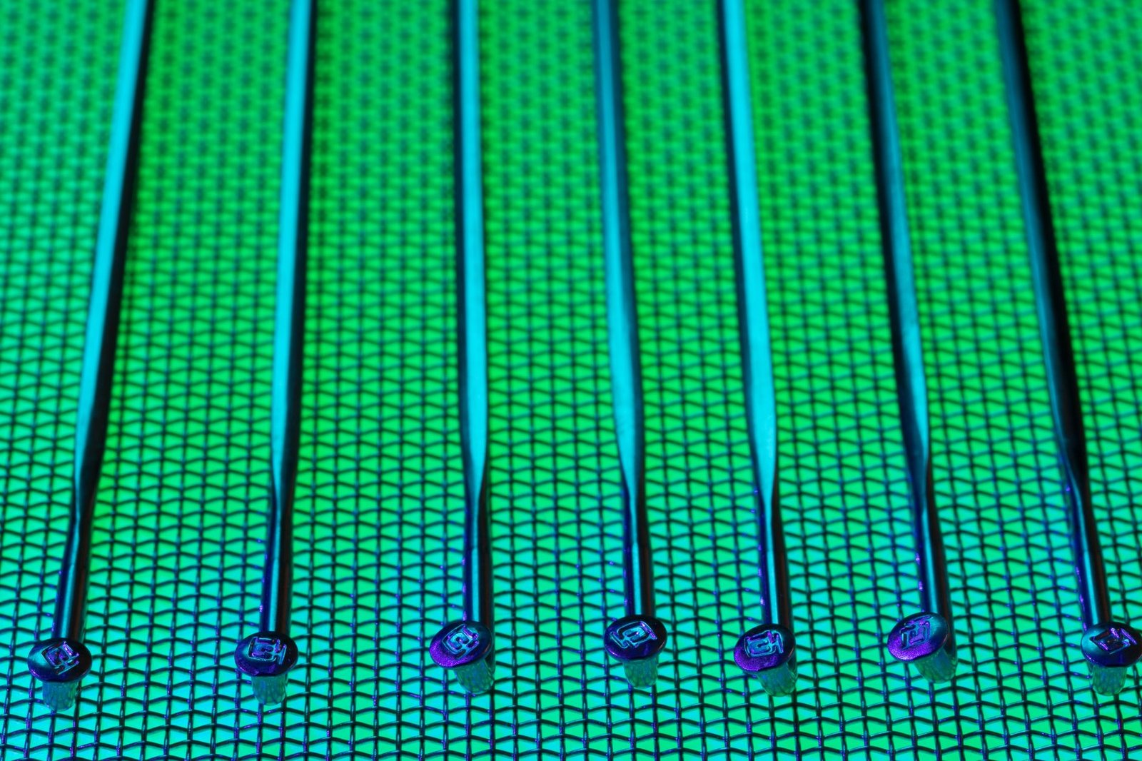 Engineer inspecting a photonic chip wafer under high magnification in a semiconductor cleanroom