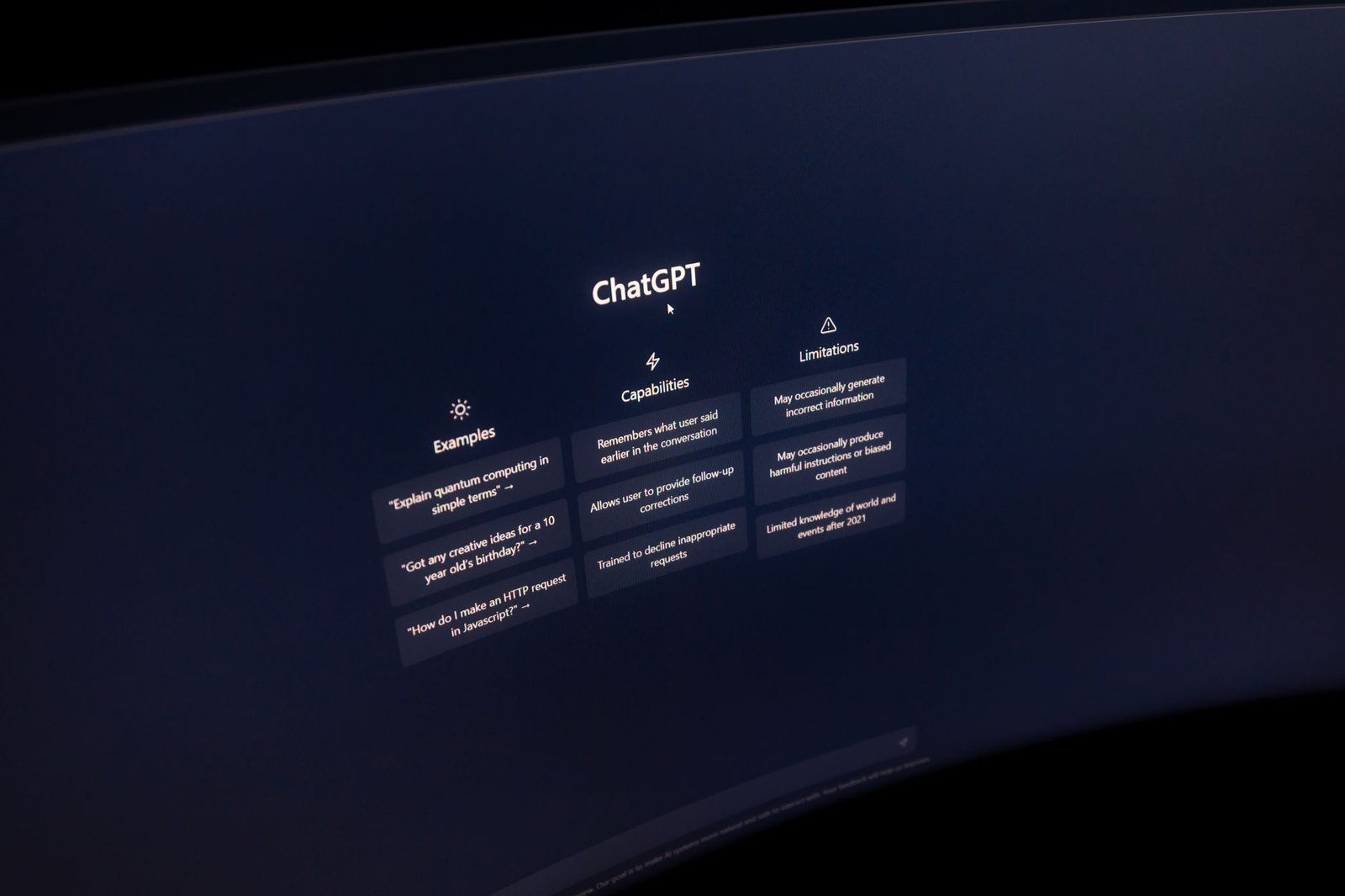 Business professional interacting with an AI chatbot interface on a laptop