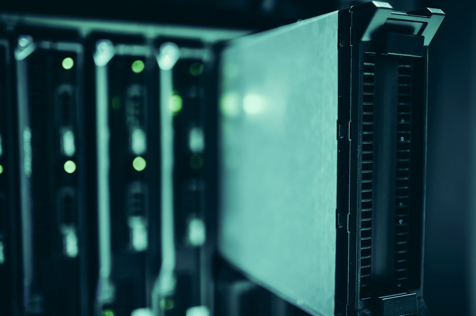 Data center with rows of server racks glowing in blue light, symbolizing the AI hardware infrastructure market